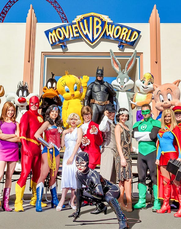 Characters in costume at Warner Bros. Movie World entrance.