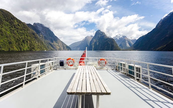 Cruise ship deck view of Milford Sound fjord with mountains in New Zealand.
