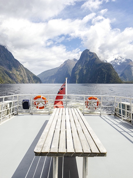 Cruise ship deck view of Milford Sound fjord with mountains in New Zealand.