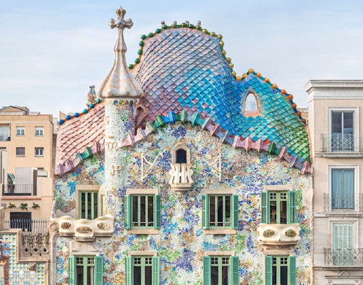 Casa Batllo facade with colorful mosaics and unique architecture in Barcelona.