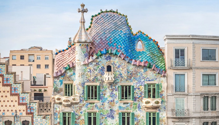 Casa Batllo facade with colorful mosaics and unique architecture in Barcelona.