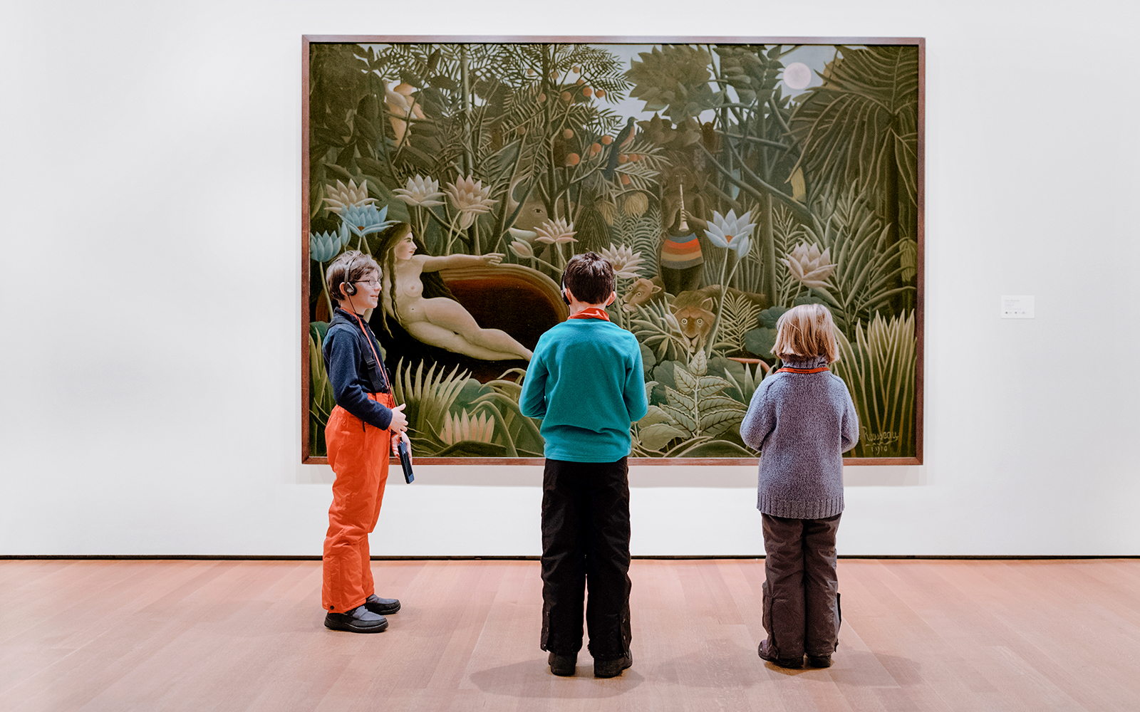 New York Museum of Modern Art interior with visitors viewing contemporary exhibits.