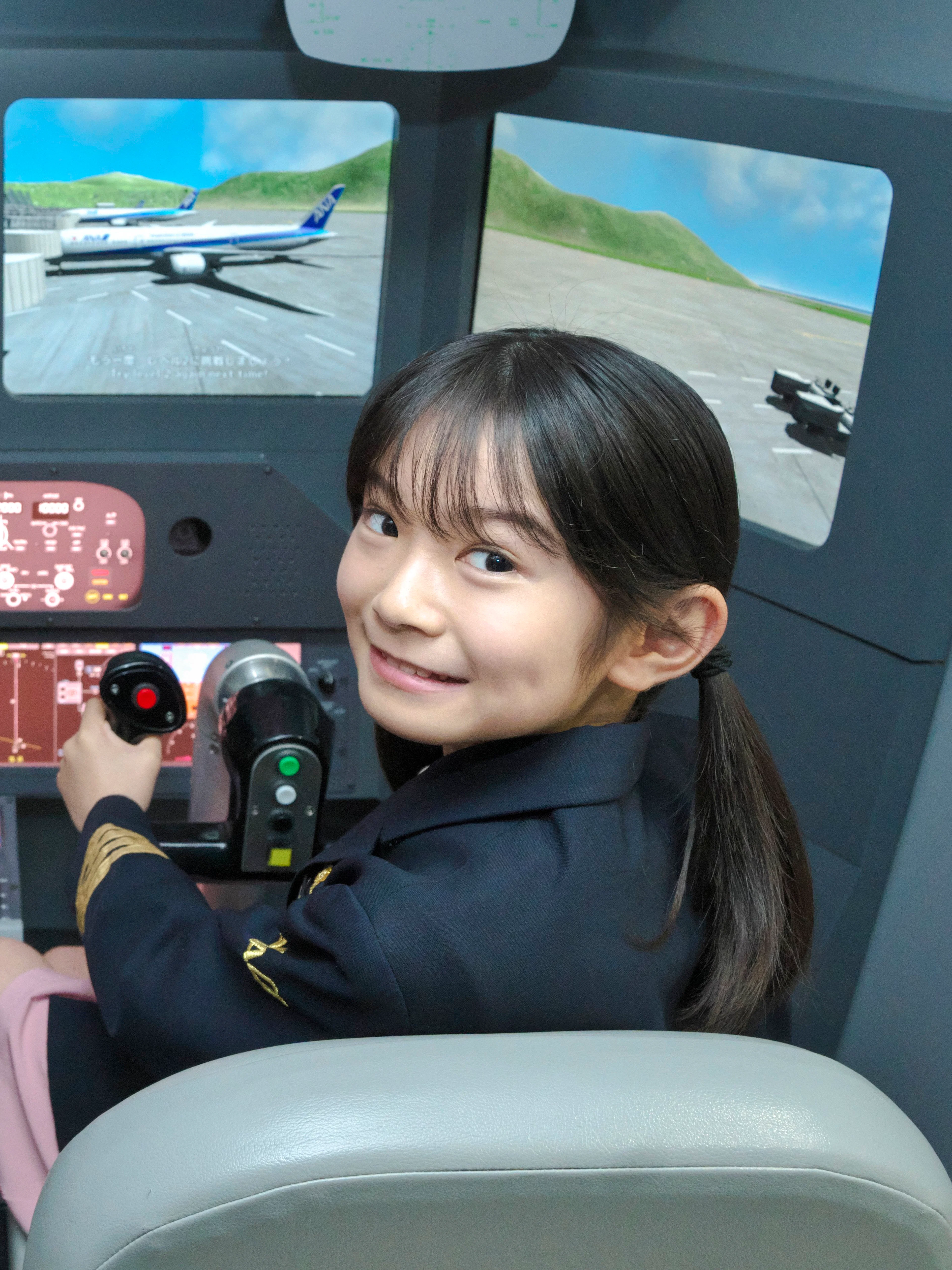 Young pilots in a flight simulator at Kidzania Tokyo.