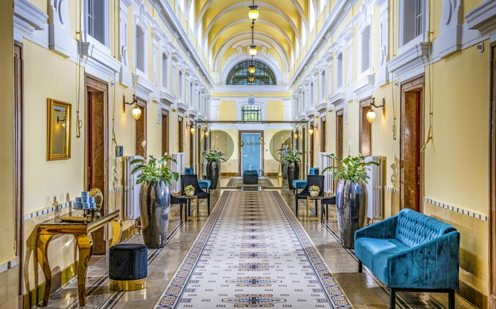 Premium Day Spa interior at Szechenyi Bath, Budapest, with elegant decor and seating.