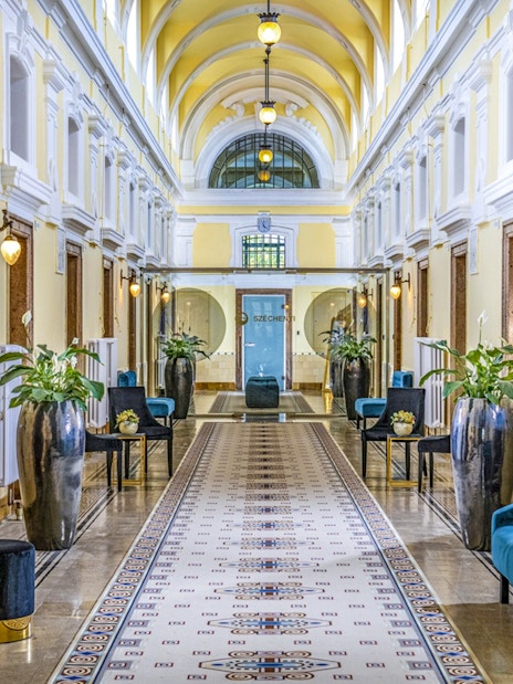 Premium Day Spa interior at Szechenyi Bath, Budapest, with elegant decor and seating.