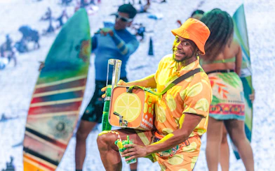Man in vibrant attire enjoying a lively samba night at Rio Scenarium, Rio de Janeiro.