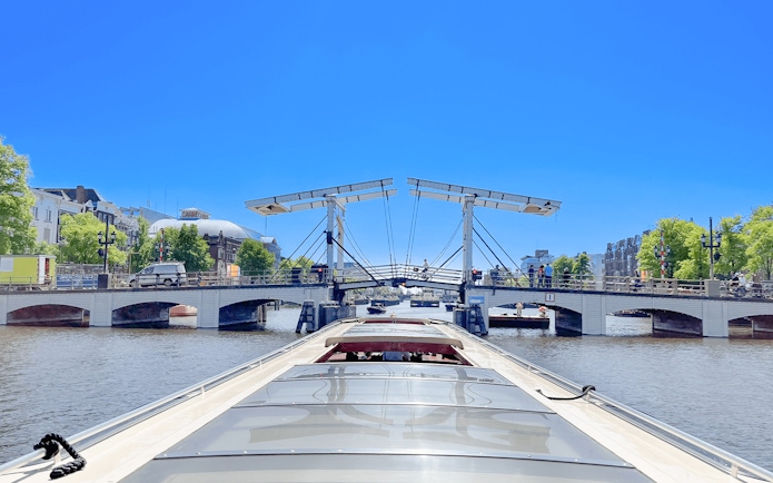 Boat approaching Amsterdam's Magere Brug on a canal cruise.
