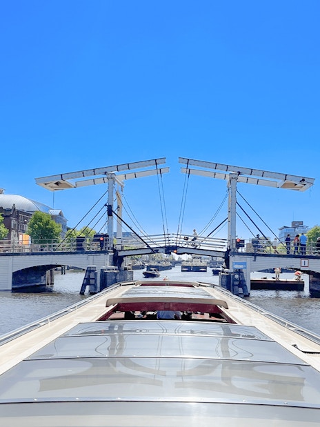 Boat approaching Amsterdam's Magere Brug on a canal cruise.