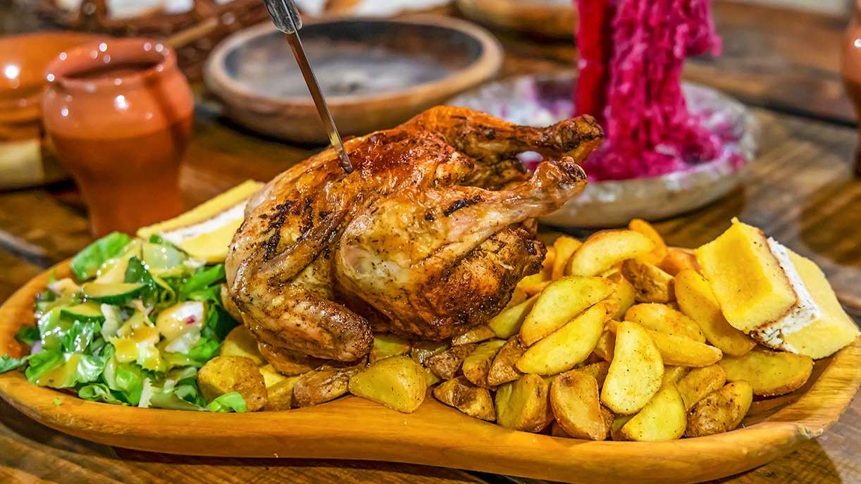 Grilled chicken with potatoes and salad at Medieval Dinner Show.