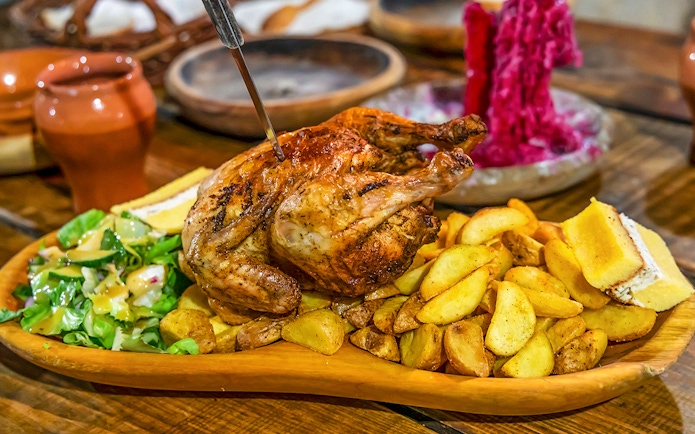 Grilled chicken with potatoes and salad at Medieval Dinner Show.