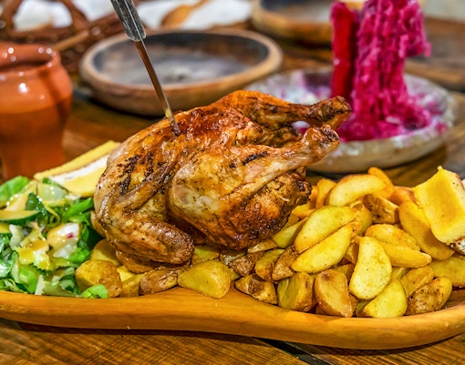 Grilled chicken with potatoes and salad at Medieval Dinner Show.