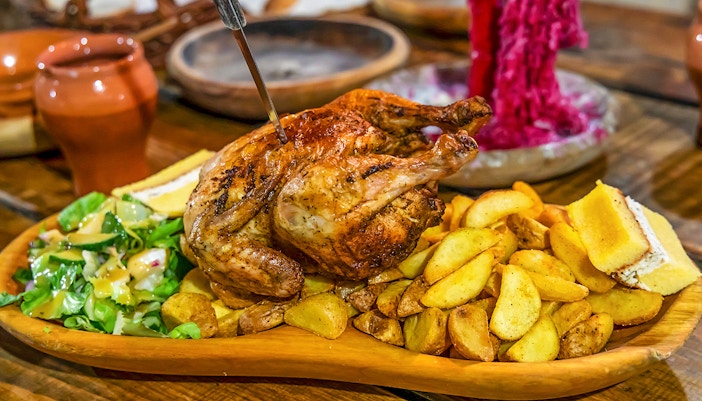 Grilled chicken with potatoes and salad at Medieval Dinner Show.