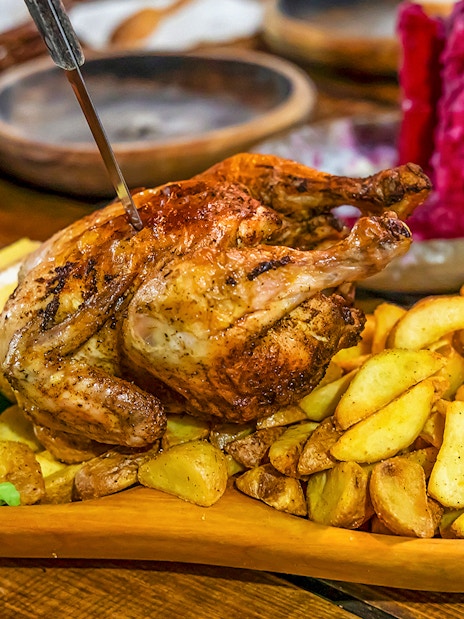 Grilled chicken with potatoes and salad at Medieval Dinner Show.