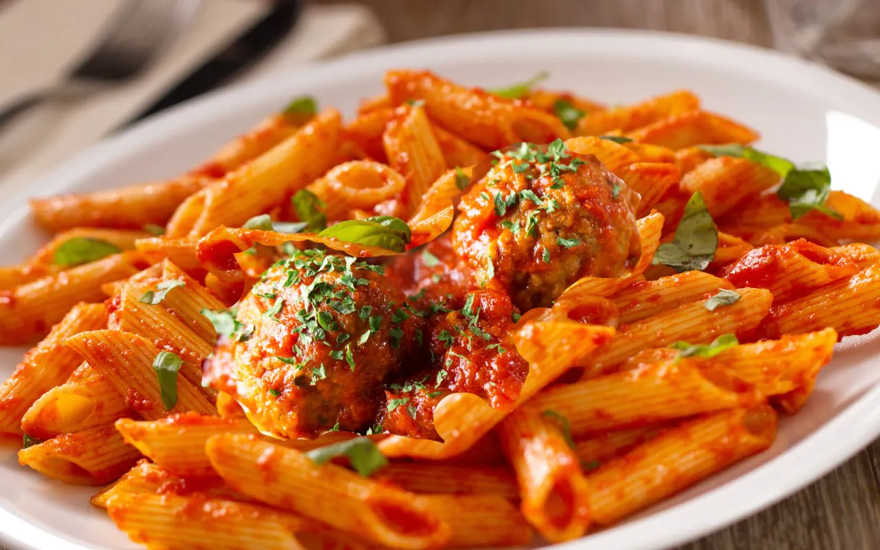 Pasta with meatballs served at the Speakeasy Murder Mystery Dinner Show in Orlando.