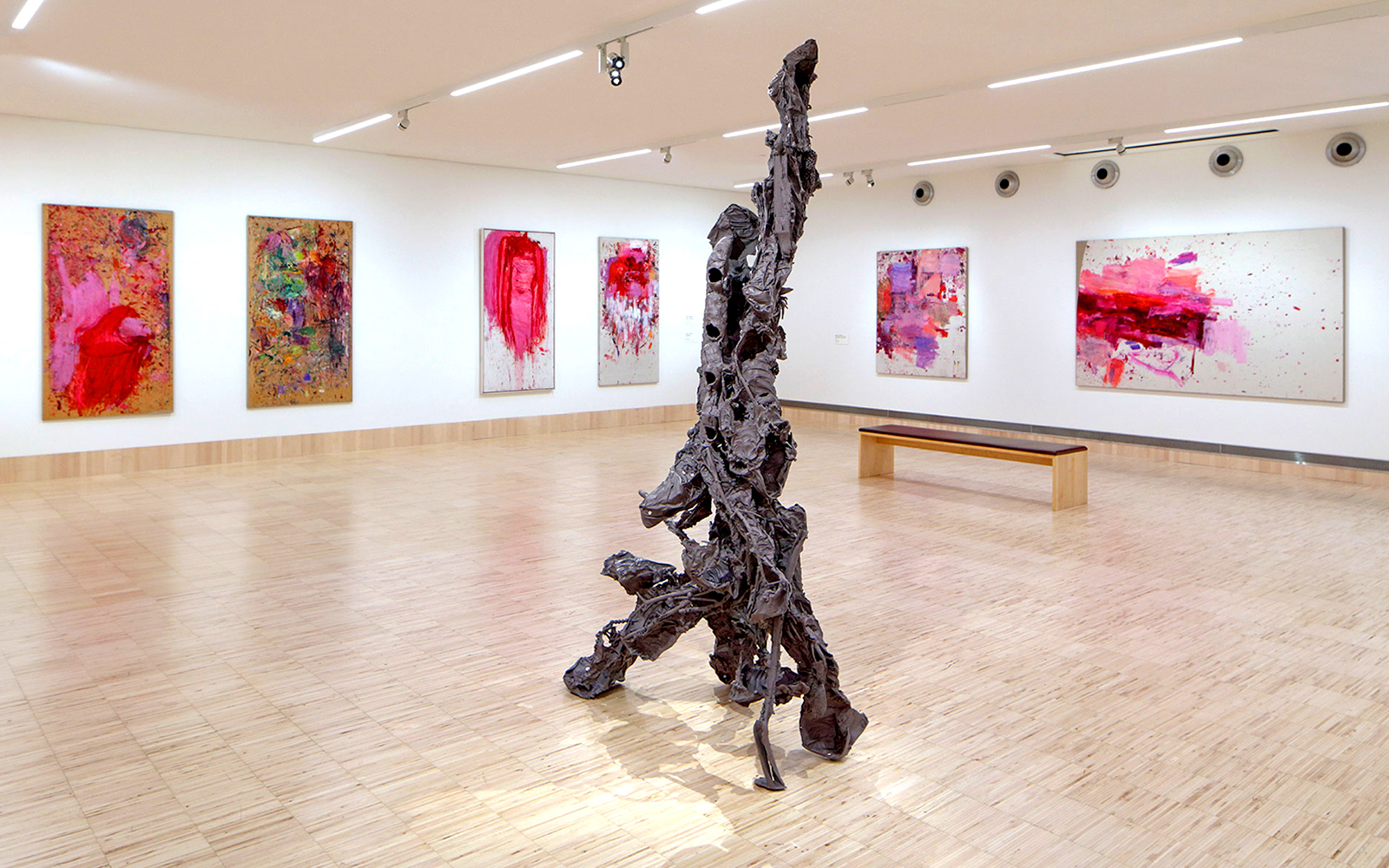 Sculpture by Albert Oehlen inside ALBERTINA KLOSTERNEUBURG gallery with abstract paintings.