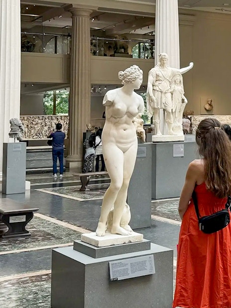 Visitors exploring sculptures at The Met Museum during a pre-orientation tour.