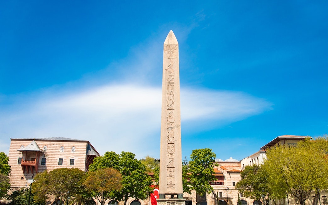 Obelisk of Theodosius in Istanbul's Old City with surrounding buildings.