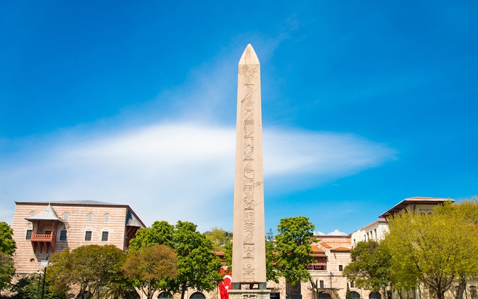 Obelisk of Theodosius in Istanbul's Old City with surrounding buildings.