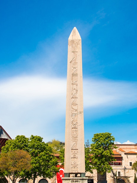 Obelisk of Theodosius in Istanbul's Old City with surrounding buildings.