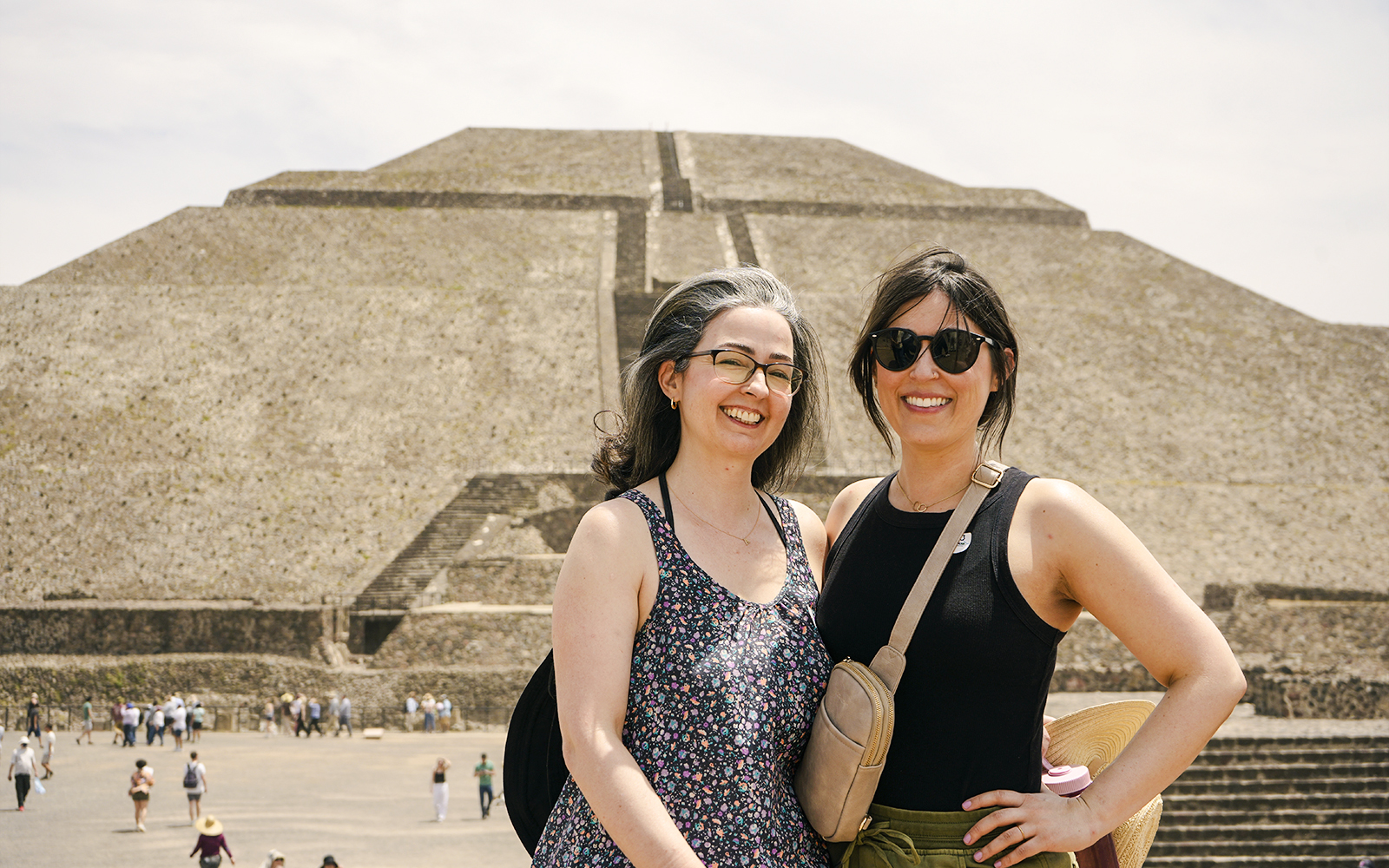 Visitors at Pyramid of the Moon, Teotihuacan, with the ancient structure in the background.