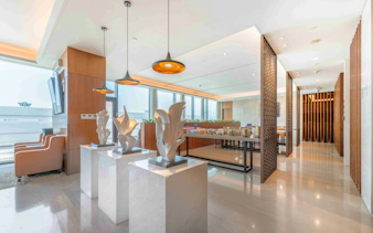 Shanghai Hongqiao International Airport Terminal 1 lounge with sculptures and seating area.