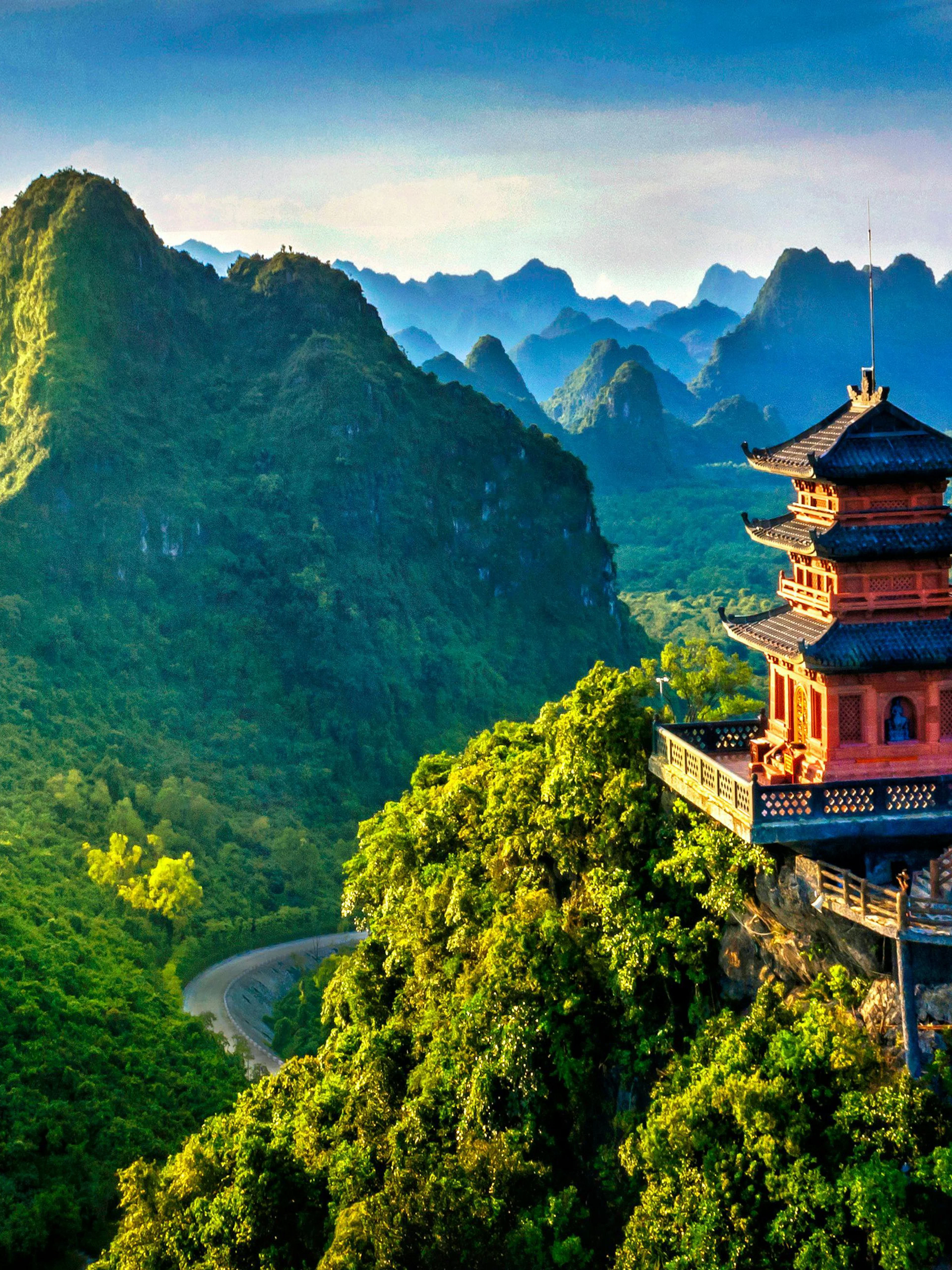 Pagoda overlooking lush mountains in Trang An Heritage, Vietnam.