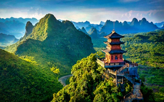 Pagoda overlooking lush mountains in Trang An Heritage, Vietnam.