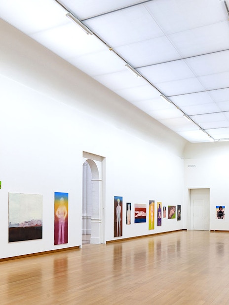 Installation view of Miriam Cahn's artwork at Stedelijk Museum, featuring colorful paintings on white walls.