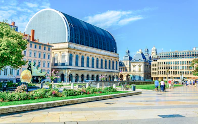 National Opera and Town Hall in Lyon, France, with surrounding plaza and visitors.