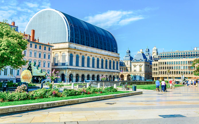 National Opera and Town Hall in Lyon, France, with surrounding plaza and visitors.