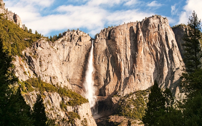 Yosemite Falls cascading down granite cliffs, Yosemite National Park, USA.