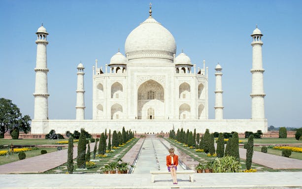 Taj Mahal with a visitor seated in front, part of Princess Diana: Accredited Access Photography Exhibition.
