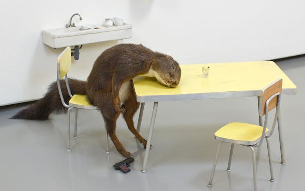 Sculpture of a taxidermy animal at a table, part of Palazzo Strozzi's "Reaching for the Stars" exhibition.