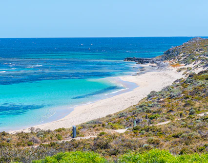 Ricey Beach on Rottnest Island with turquoise waters and sandy shoreline.