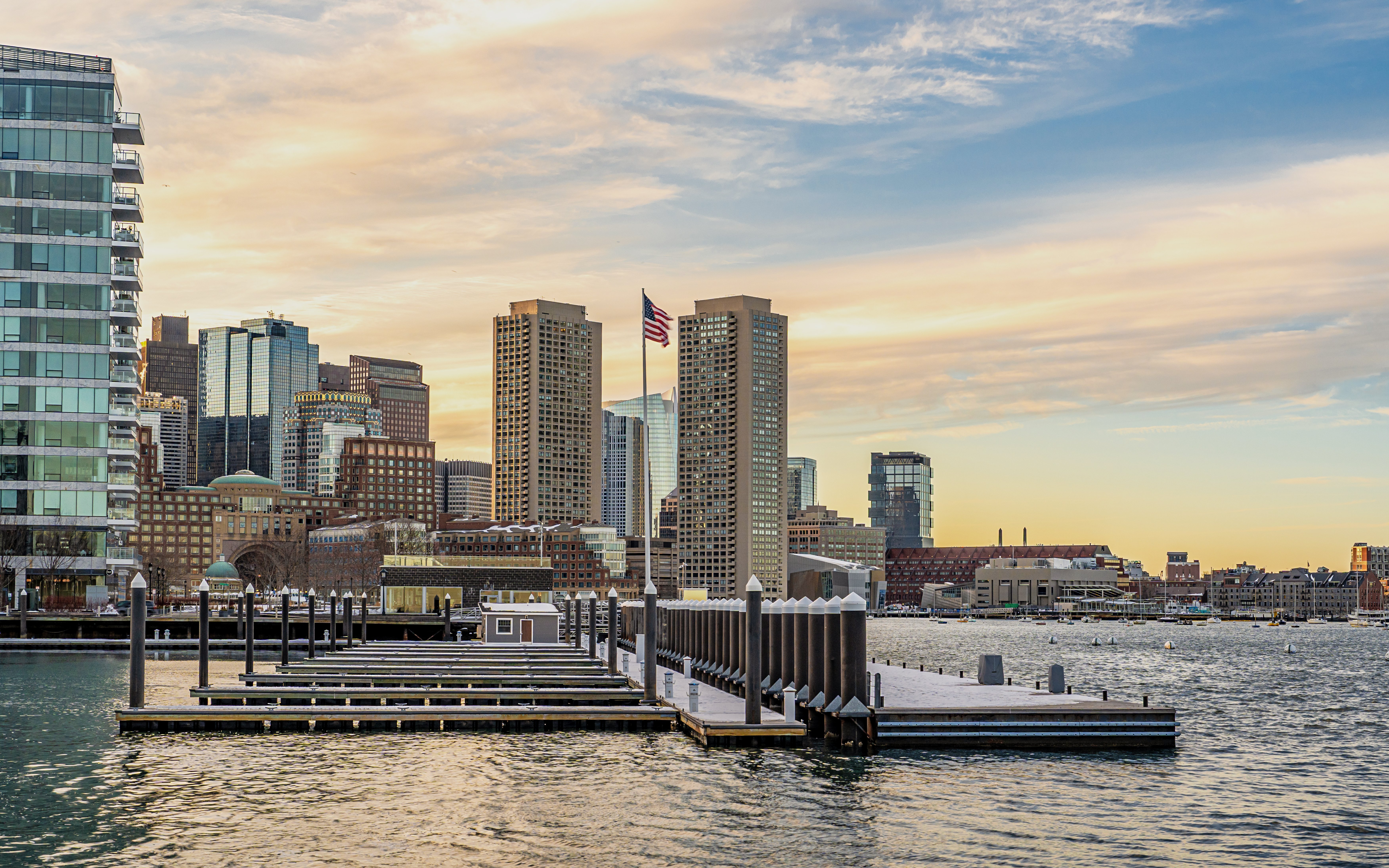 Boston downtown skyscrapers viewed from Seaport District on a winter evening.
