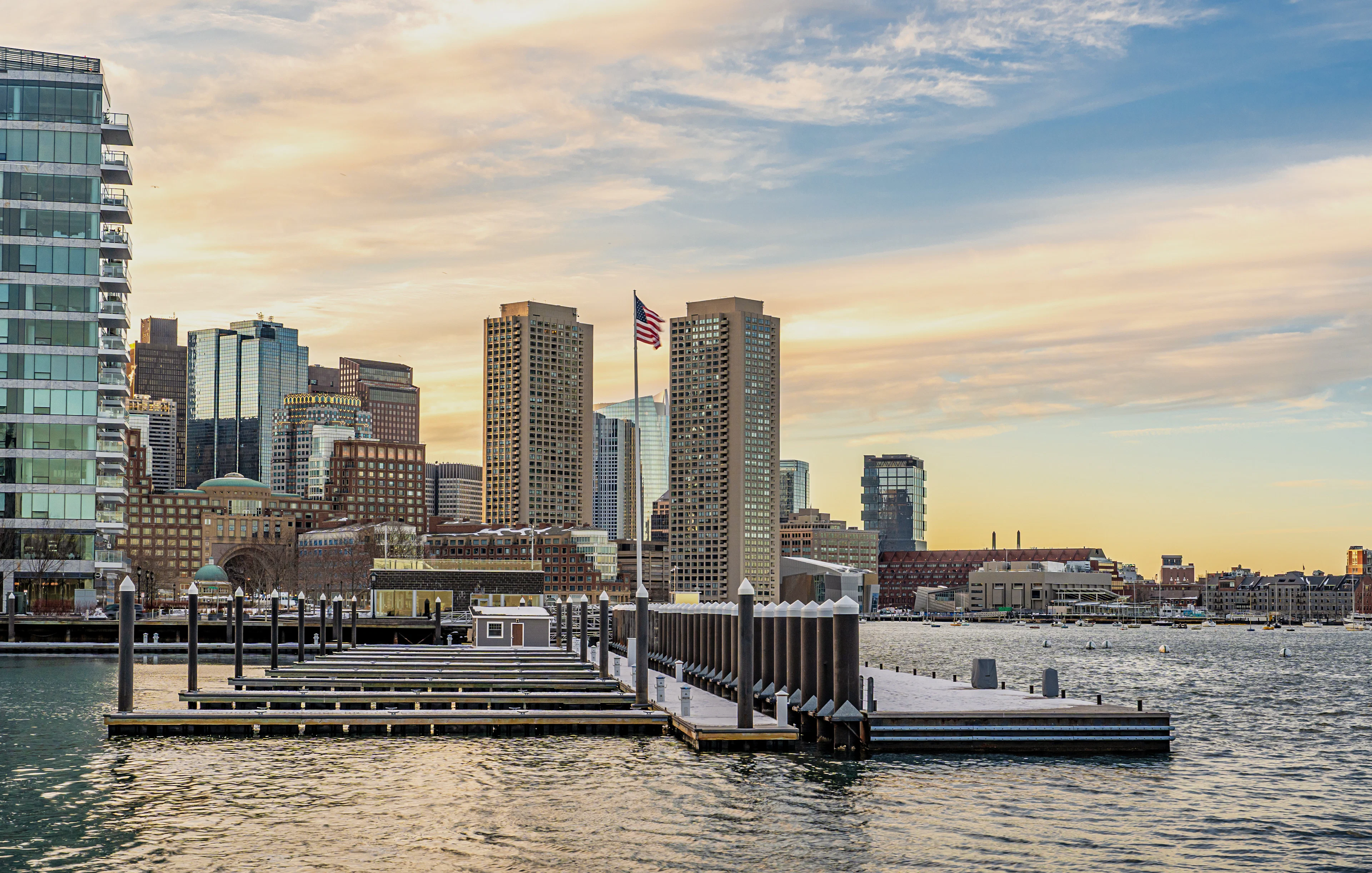 Boston downtown skyscrapers viewed from Seaport District on a winter evening.