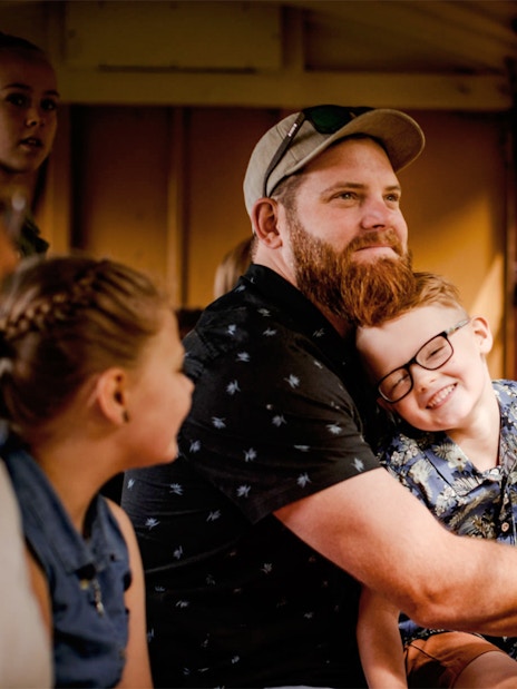 Father and son inside Puffing Billy train, Dandenong Ranges tour.