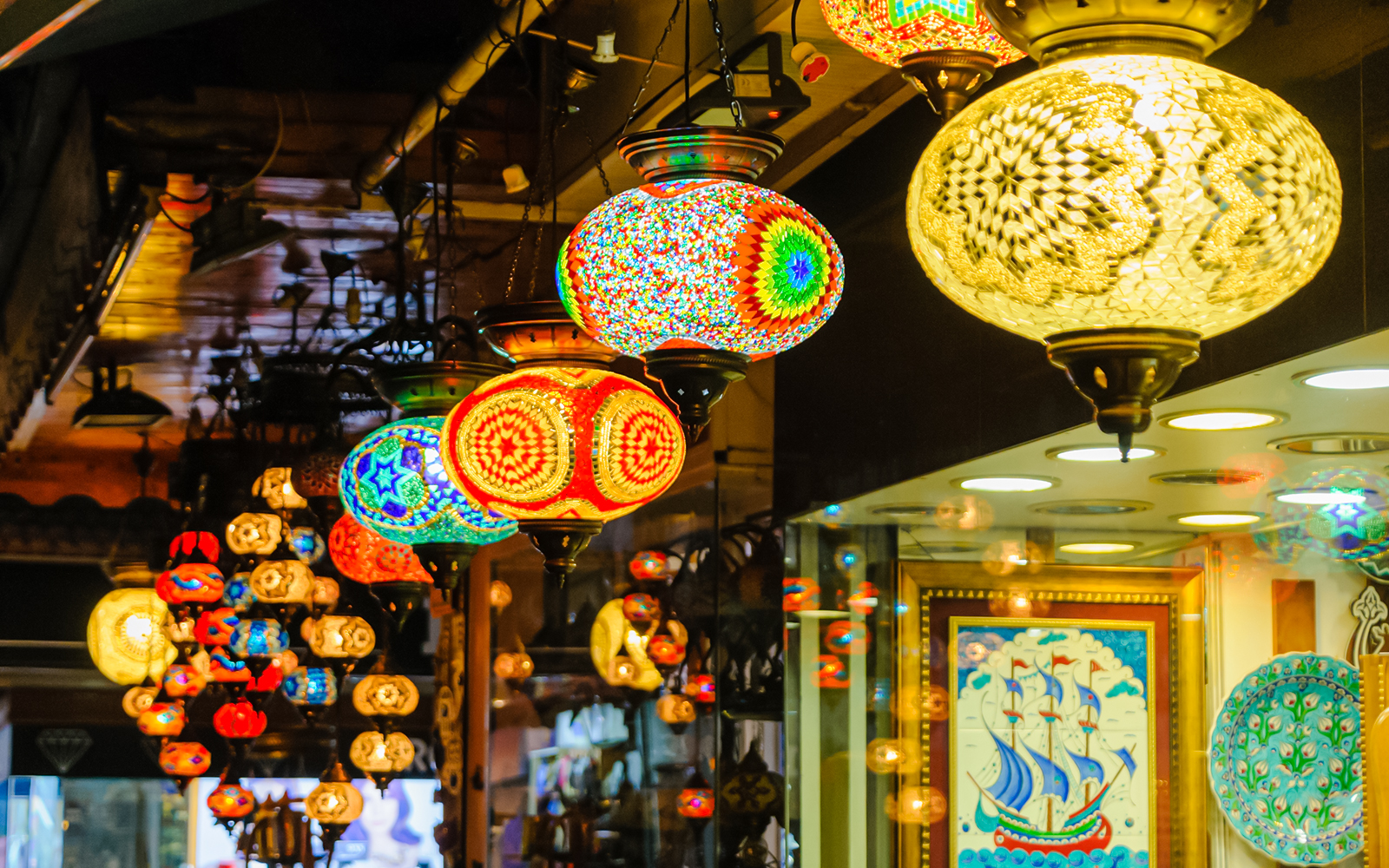 Colorful Turkish lampshades hanging in a market in Turkey.