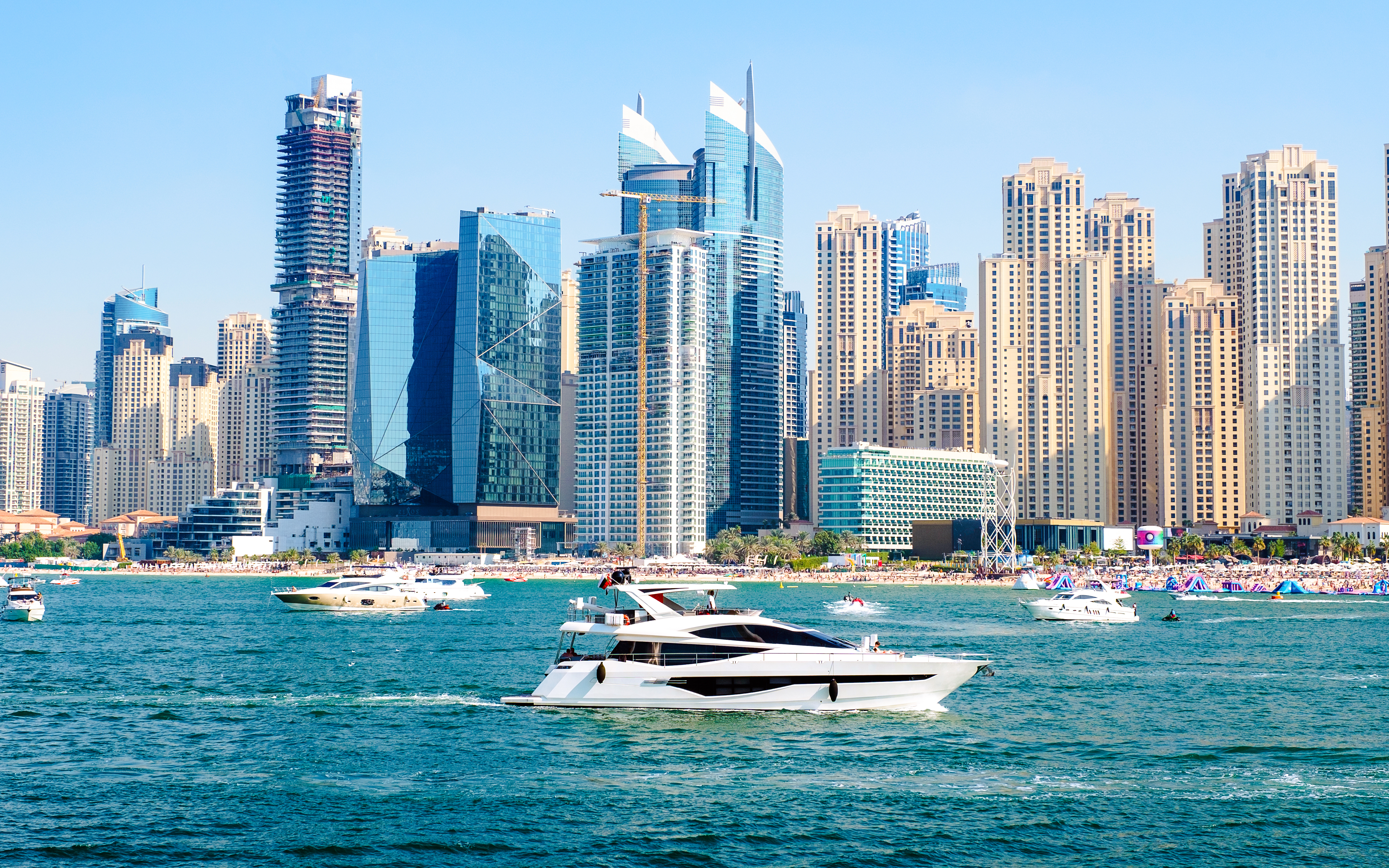 Luxury motor yachts sailing at Persian Gulf, Dubai, United Arab Emirates