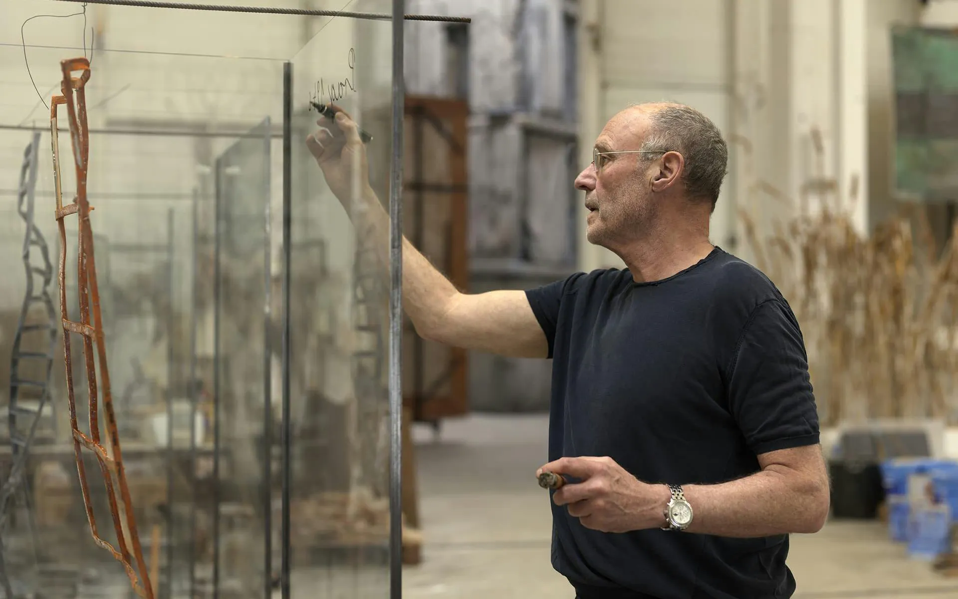 Artist working on glass installation at Casa Mila & Anselm Kiefer Exhibition.