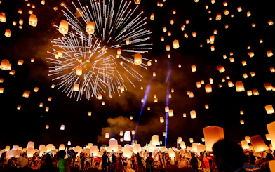 Sky lanterns and fireworks illuminate the night at Chiang Mai Sky Lanterns Festival.