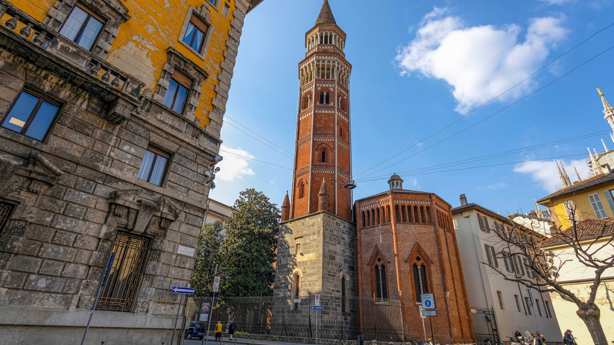 San Gottardo church tower in Milan with surrounding historic buildings.