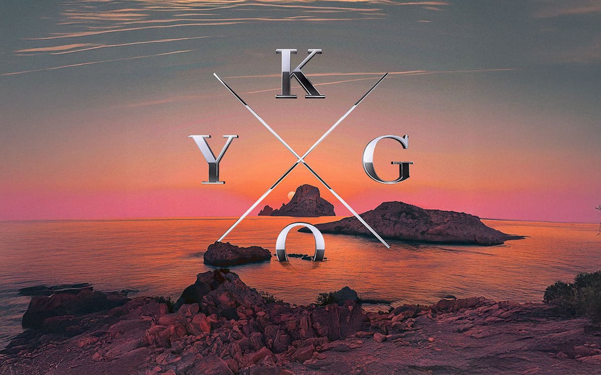 Sunset view of rocky coastline in Ibiza with Kygo logo overlay.