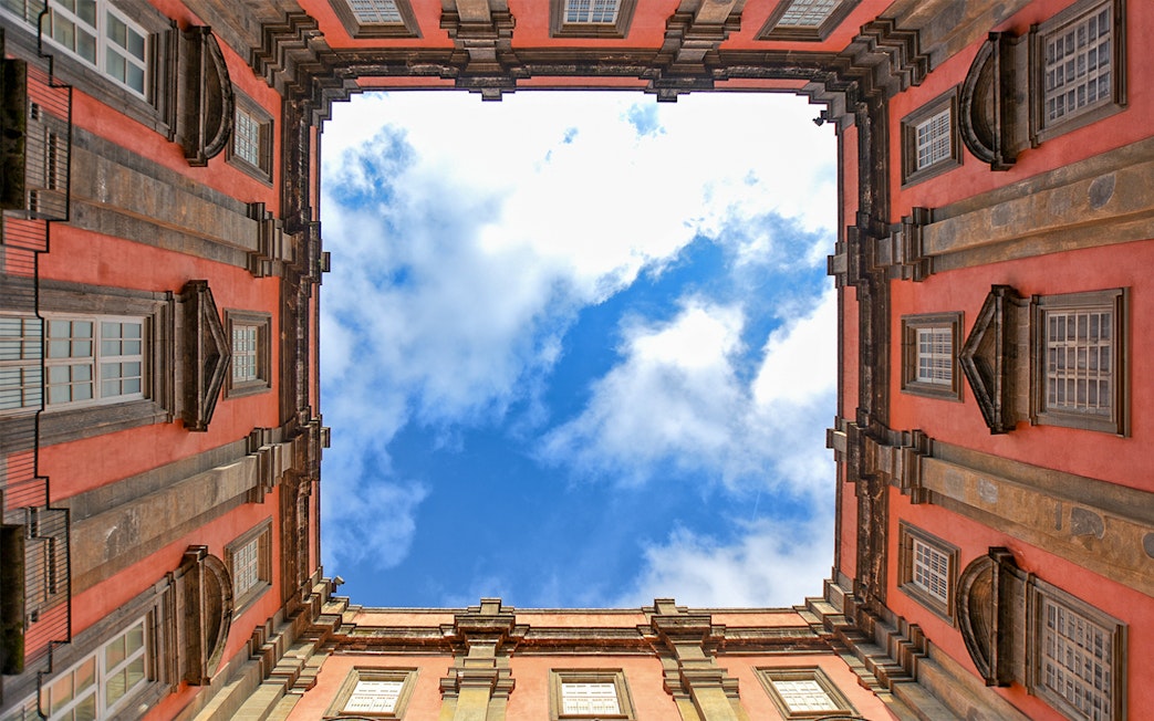 View of the sky framed by the courtyard of Museo di Capodimonte, Naples.
