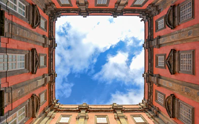 View of the sky framed by the courtyard of Museo di Capodimonte, Naples.
