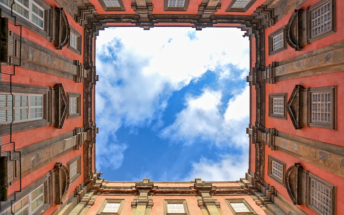 View of the sky framed by the courtyard of Museo di Capodimonte, Naples.