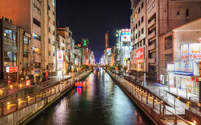 Tombori River Cruise at night, view of illuminated Dotonbori, Osaka.