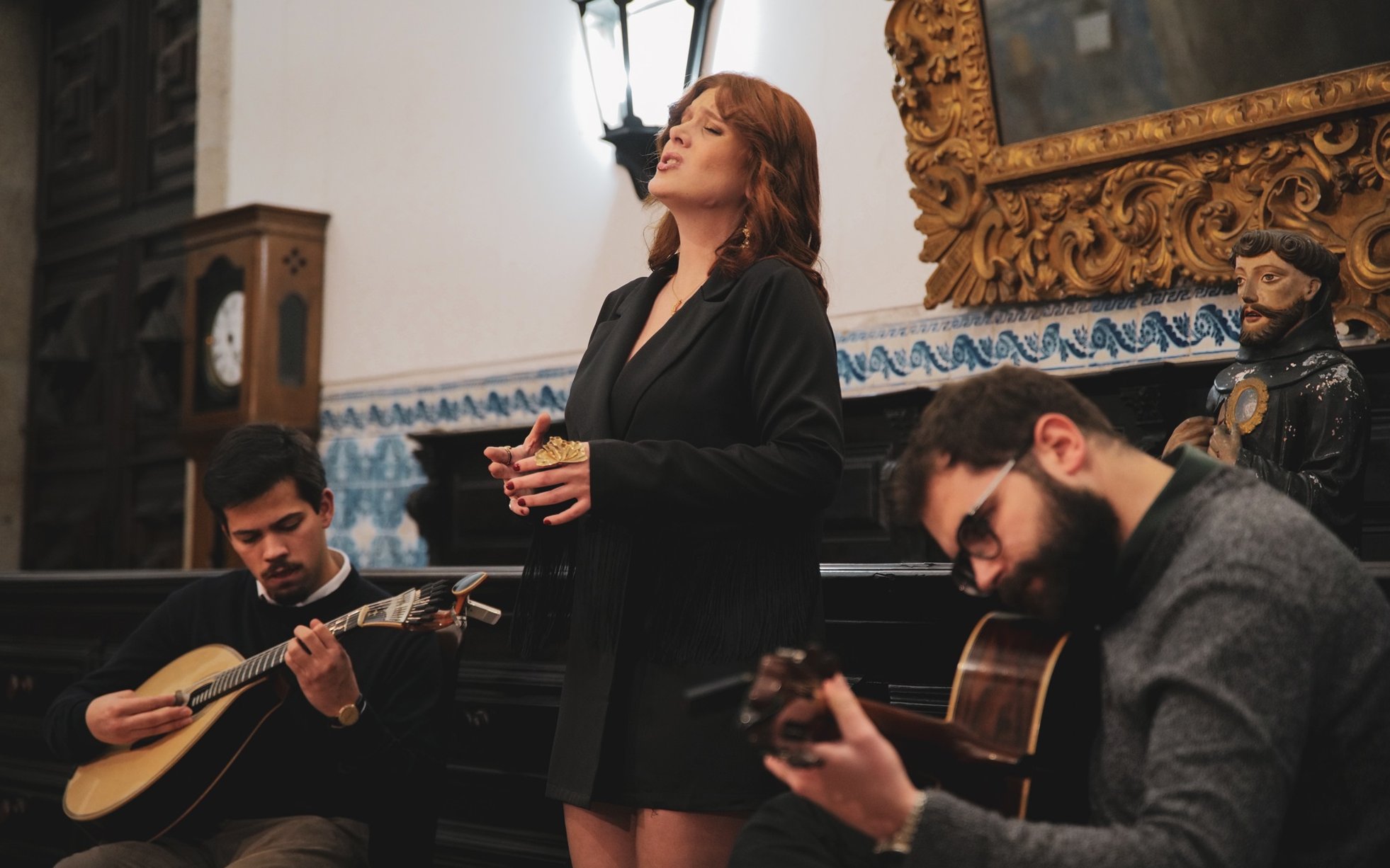 Fado performance with musicians at São Bento da Vitória Monastery, Porto.