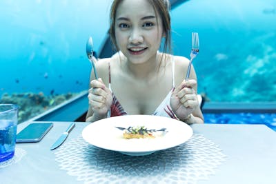 Woman dining in Ocean Restaurant