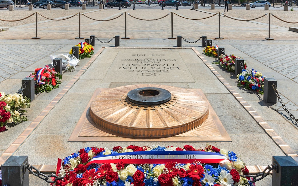 Tomb of the Soldier with eternal flame and wreaths at the Arc de Triomphe, Paris.
